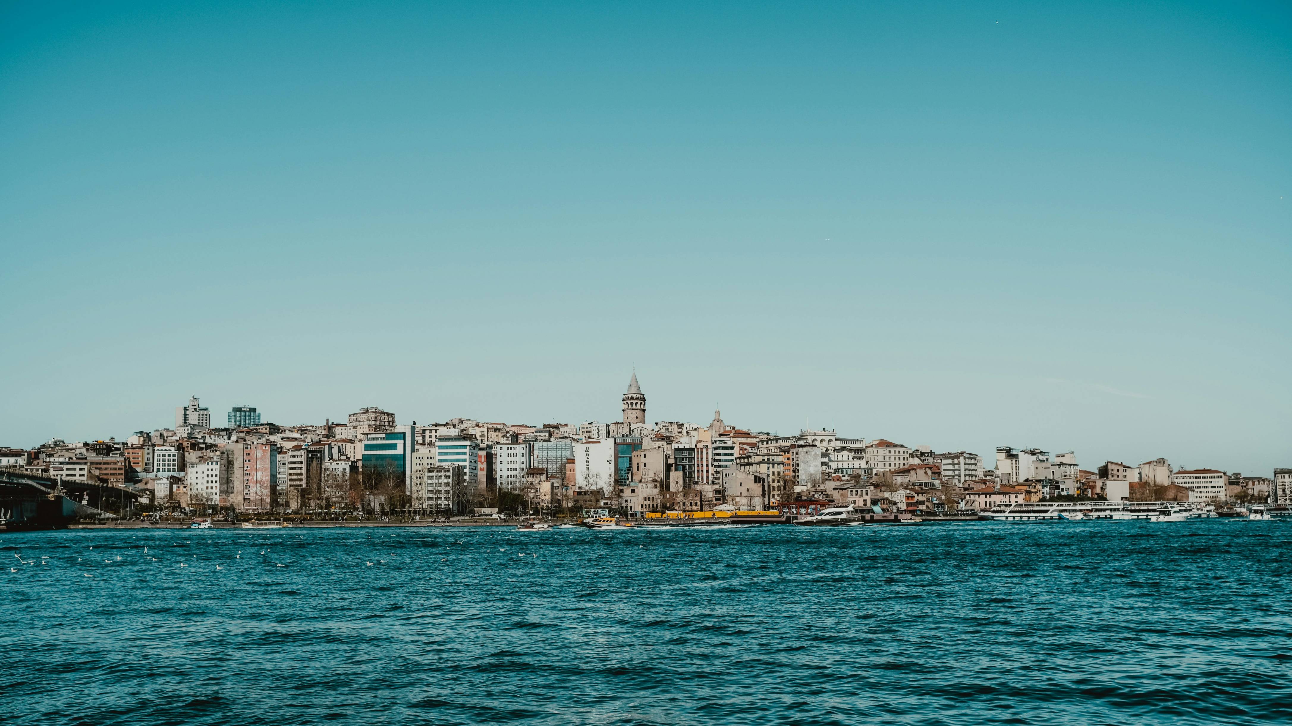 a large body of water with a city in the background