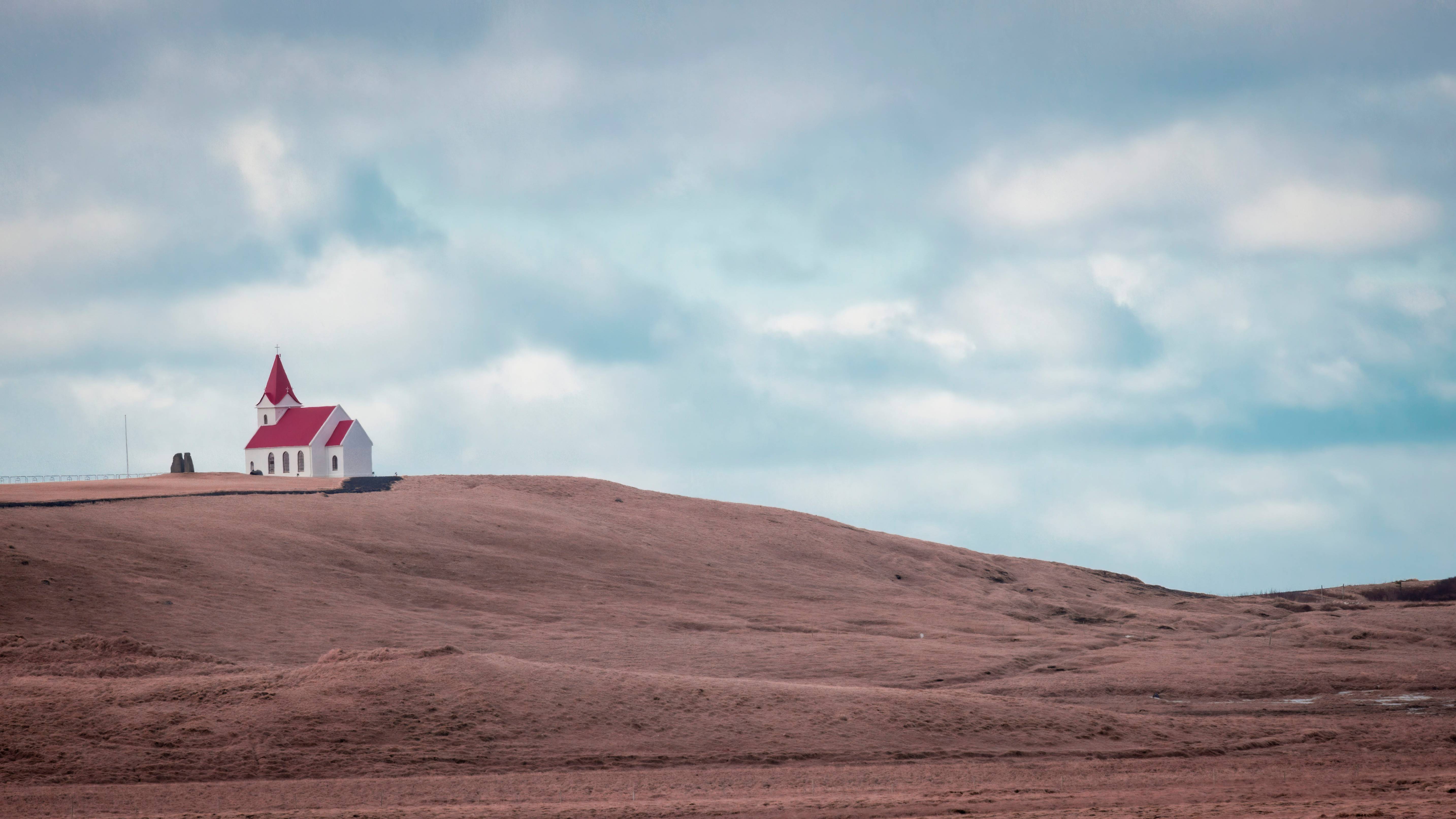 a small church on top of a hill